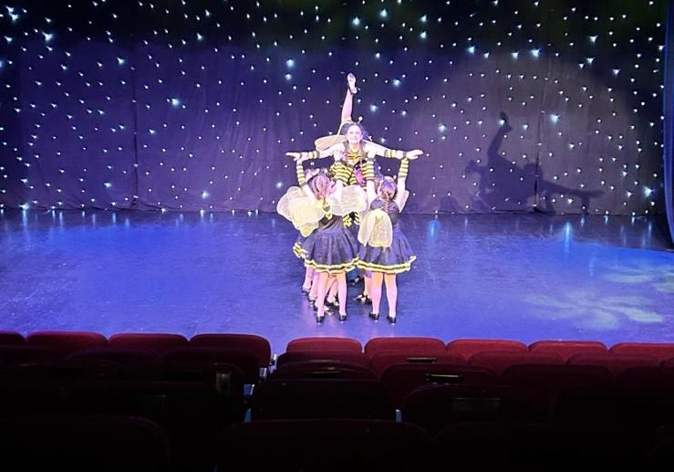 Modern dance performance featuring Clairemarie’s School of Dance students